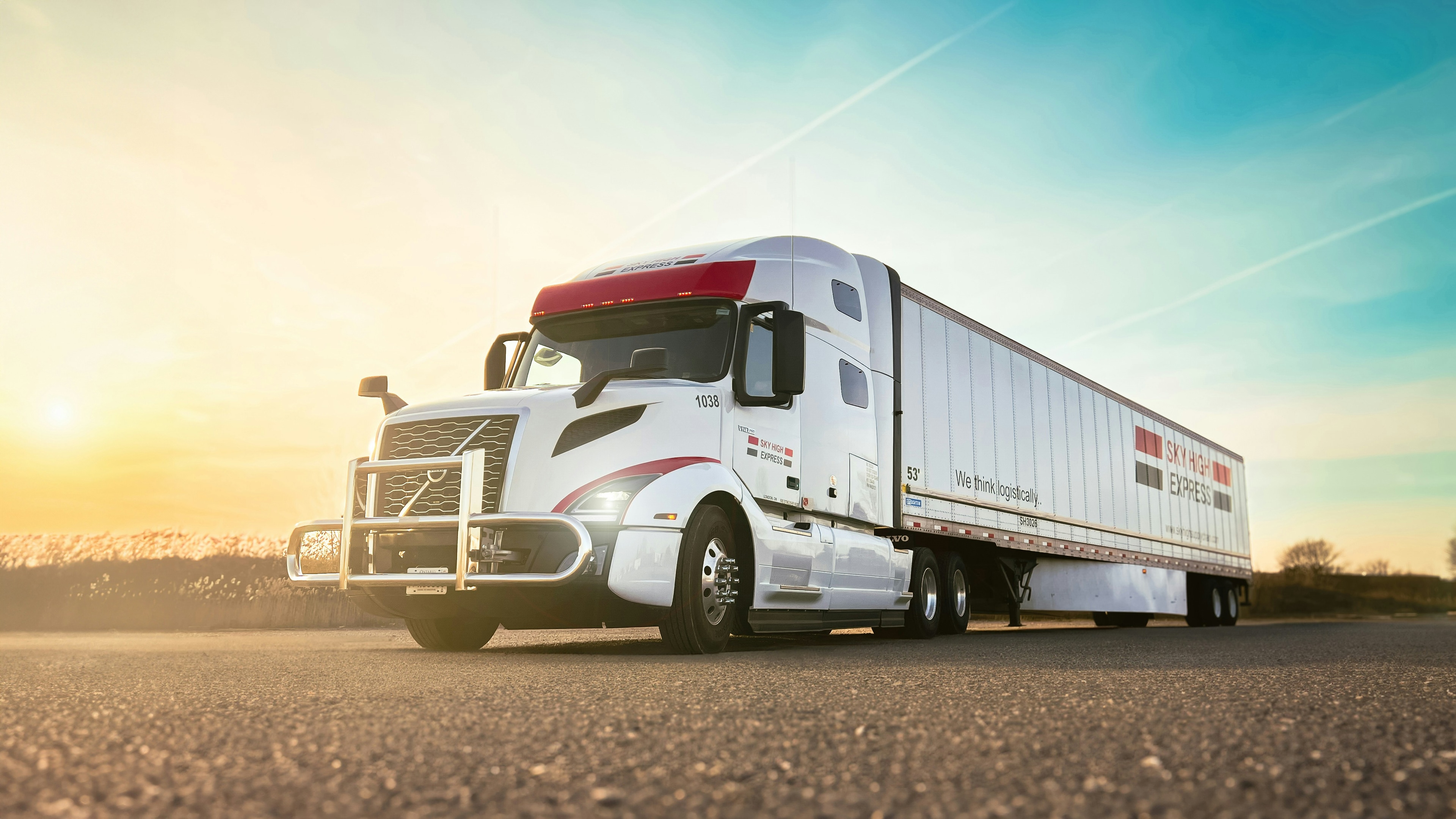 Semi truck driving on highway at sunset used as hero image for California CARB truck compliance and emissions services